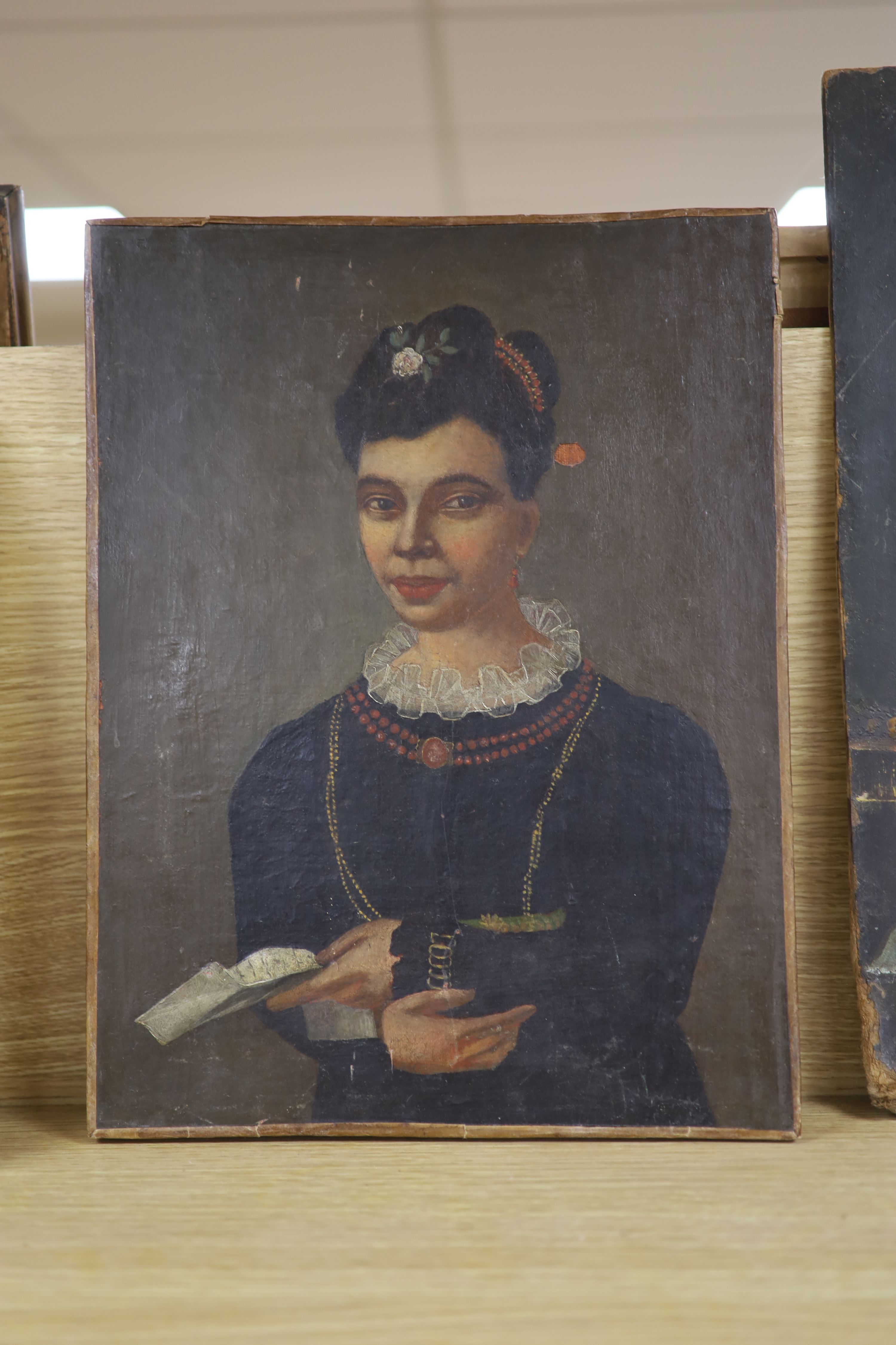 19th century French school, a stylised waist length portrait of a young lady, wearing pearls and coral beads, oil on canvas, unframed, indistinctly labelled verso, 39 x 29cm